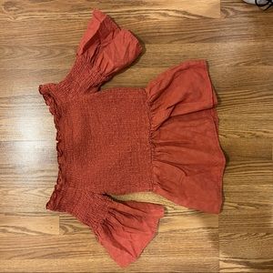 Deep pink color off the shoulder shirt with details